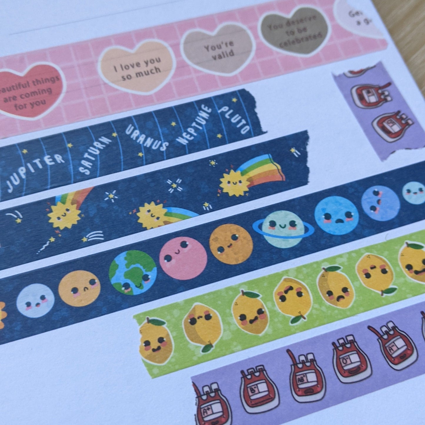 Collection of decorative stickers with various designs on a light surface.
