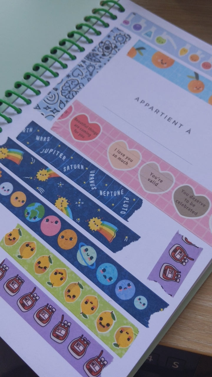 Collection of decorative stickers with various designs on a light surface.